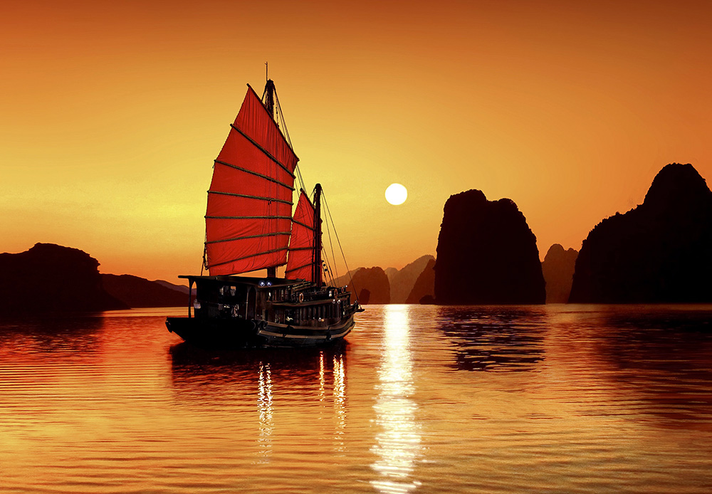 Junk in the sea of Halong Bay, a UNESCO World Natural Heritage Site, Karst mountains, romantic sunset, image composition, Vietnam, Asia